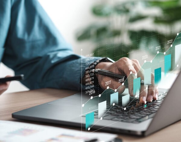 Businessman analyzing digital financial balance sheet of company working with digital virtual graphic design. Calculating long-term investment financial data icon on touch screen